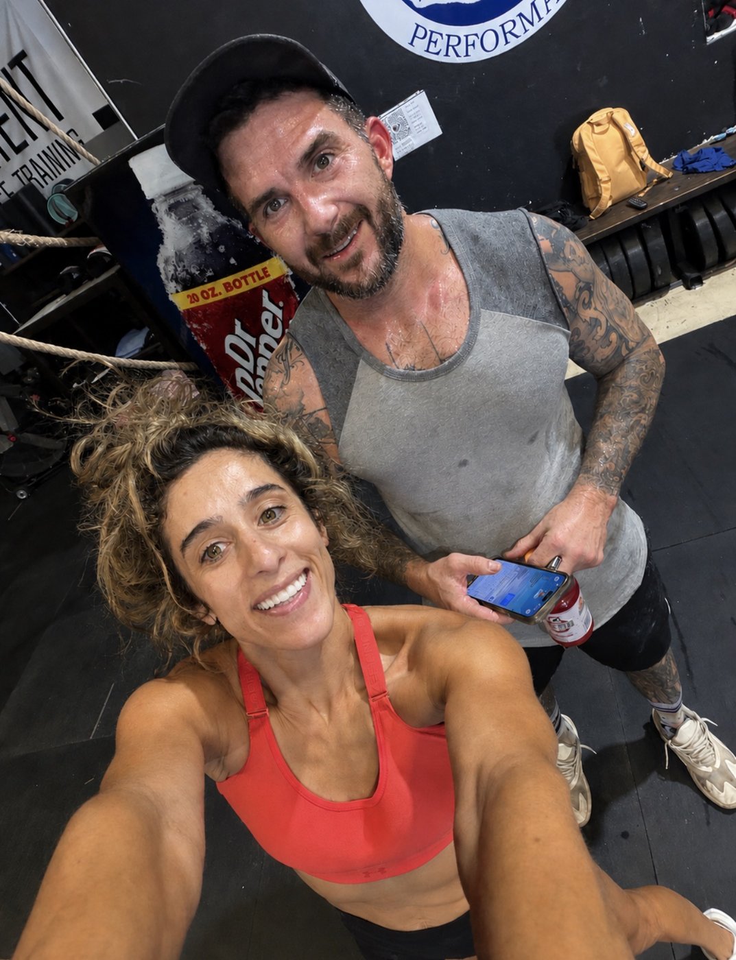 Two smiling adults together at APT after a workout