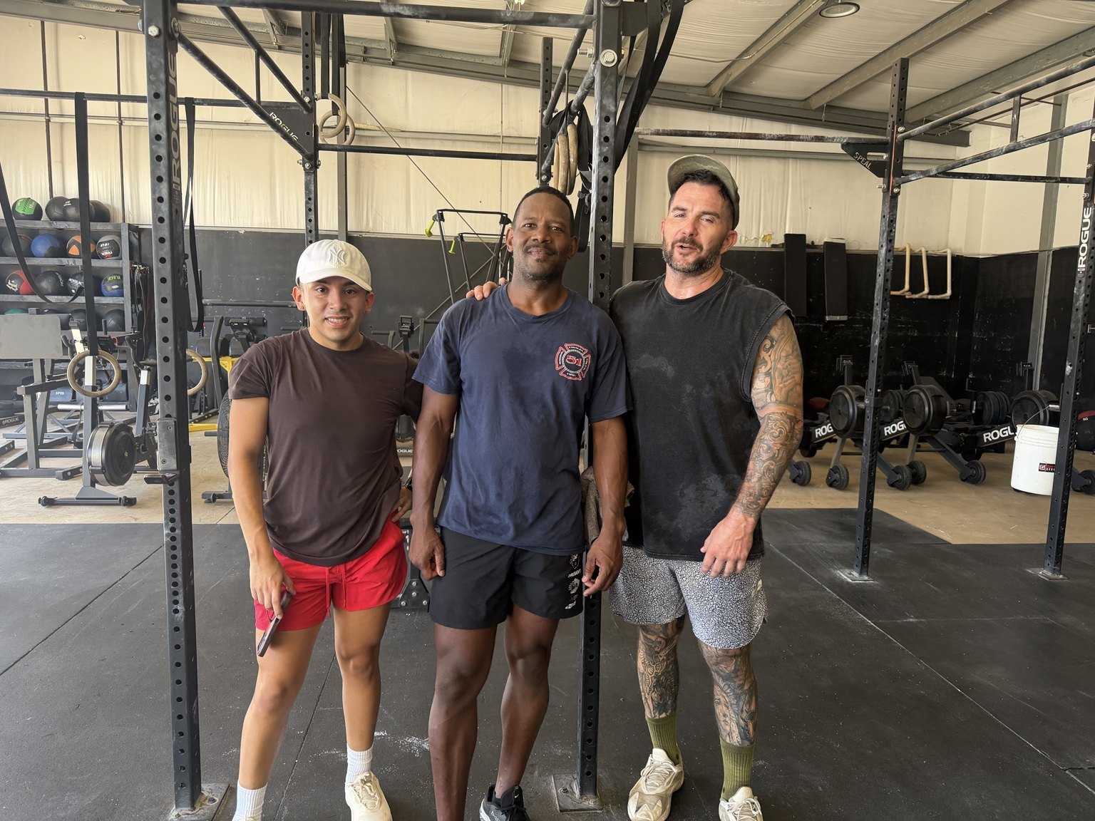 Three members standing together inside Alignment Performance Training